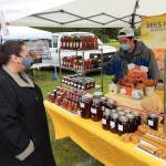 Bees in the Burbs, run by proprietor Andrew Kim, was among the vendors at this years Auburn Farmers Market, which opened in June, but with several COVID-19 related rules including masks and social distancing for customers. Photo by Robert Whale/Auburn Reporter