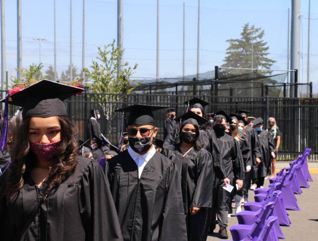 West Auburn High graduates line up to accept their diplomas during graduation ceremonies Saturday afternoon. Courtesy photo.