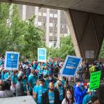 County employees and supporters file out of the courtyard at the King County Administration building during a march for womens safety at work in Seattle on Friday, Aug. 6, 2021. The march was scheduled after a woman was attacked in a bathroom at the King County Courthouse. Photo by Henry Stewart-Wood/Sound Publishing