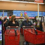 Henry Stewart-Wood / Sound Publishing
Auburn Mayor Nancy Backus and Kent Mayor Dana Ralph in an intense staredown prior to their race Oct. 5 for Battle of the Badges at Grocery Outlet in Auburn. The food collected in the competition was donated to the Auburn Food Bank.