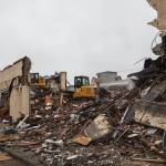 Excavators demolish the Max House Apartments complex in downtown Auburn on Wednesday, Dec. 15. Photo by Henry Stewart-Wood/Sound Publishing