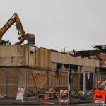 Excavators demolish the Max House Apartments complex in downtown Auburn on Wednesday, Dec. 15. Photo by Henry Stewart-Wood/Sound Publishing