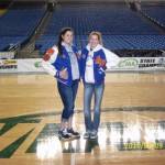 Cait Carr, left, and Aly (Carr) Lacey pose for a photo in their varsity jackets. The sisters played together at Auburn Mountainview High School but now coach girls basketball at Auburn Mountainview and Kentlake High School, respectively. (Photo courtesy of Marla Carr)