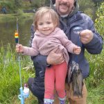 Photo by Robert Whale, Auburn Reporter
Isabel Palady, all of 2 years old, displays the first fish she has ever caught, at the 60th annual fishing derby at Mill Creek Pond last Saturday.