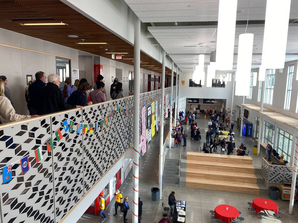 A tour group looks onto the Thomas Jefferson High School commons space below. Olivia Sullivan/the Mirror