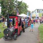 Photo courtesy of the City of Auburn
A trackless train gives kids a ride through the park at one of Auburns previous Fourth of July Festivals.
