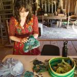 Amanda Triplett, Mary Olson Farms current Artist in Residence, explains the process of creating textile sculptures from scrap fabrics. Photo by Henry Stewart-Wood/Sound Publishing