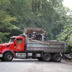 County workers cleaned trash and debris along the Green River Road in unincorporated King County. Henry Stewart-Wood/Sound Publishing
