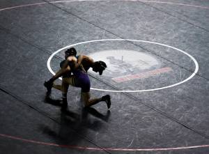 Wrestlers are silhouetted against a black wrestling mat during the Mat Classic XXXIII on Feb. 19, 2022, in Tacoma, Washington. (Olivia Vanni / Sound Publishing)