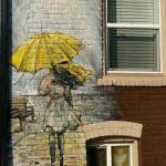 This eye-catching mural of a girl under umbrella graces the outer brick wall of G Street Legal on A St. SE.