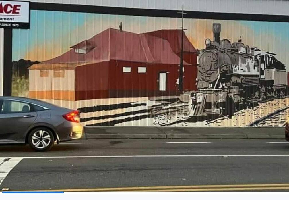 In Seattle artist Mira Hoke's mural, the old Auburn Depot lives again on the west side of the Agrishop. Photo courtesy of Downtown Auburn Cooperative.
