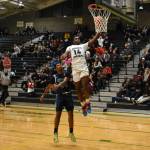 Auburns Luvens Valcin rises above the Ravens on his way to a 12-point performance. Photo by Ben Ray/Sound Publishing