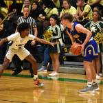Trojan sophomore Jaylen Petty looks to lockdown Tahoma senior Kevin Williams. Photo by Ben Ray/Sound Publishing
