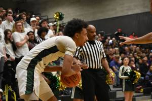 Senior Semaj Brown scopes out the defense against ODea. Ben Ray / The Reporter
