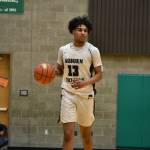 Trojan senior Tyrell Nichols takes the ball up the floor for Auburn. Ben Ray / The Reporter