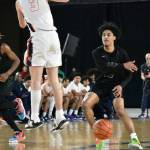 Trojan Tyrell Nichols (12) whips a pass to a teammate in the fourth quarter. Ben Ray / The Reporter