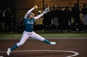 Raven pitcher Lexi Vircks pitches in the Riverside season opener. Ben Ray / The Reporter