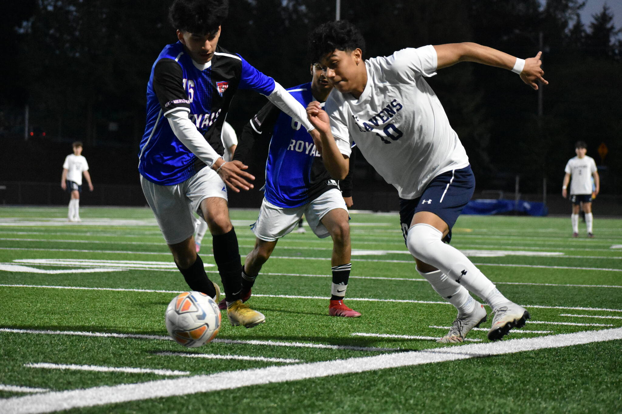 Riversides Daniel Hernandez (10) fights for possession and momentum. Ben Ray / The Reporter