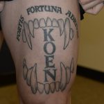 Courtesy photo
Photo of Jeffrey Nelsons thigh shows a tattoo of Nelsons Auburn Police K9s name Koen set in between canine teeth and a Latin phrase which translates to fortune favors the bold. These photos were taken by the FBI after Nelson was charged with murder.