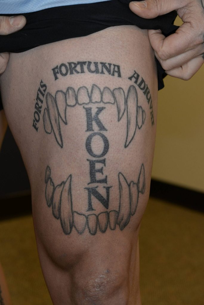 Courtesy photo
Photo of Jeffrey Nelsons thigh shows a tattoo of Nelsons Auburn Police K9s name Koen set in between canine teeth and a Latin phrase which translates to fortune favors the bold. These photos were taken by the FBI after Nelson was charged with murder.