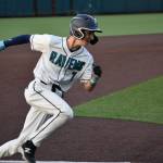 Riverside catcher Cade Huffman rounds third on his way home to score for the Ravens. Ben Ray / The Reporter