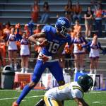 Auburn Mountainviews Jalen Hicks topples a defender. Ben Ray / The Reporter