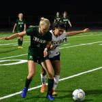 Brynn Casperson (11) takes on the contact. Ben Ray / The Reporter