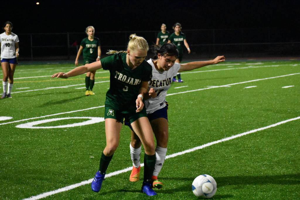 Brynn Casperson (11) takes on the contact. Ben Ray / The Reporter