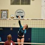 Senior Sydney Priebe goes in for the kill in the first set. Ben Ray / The Reporter