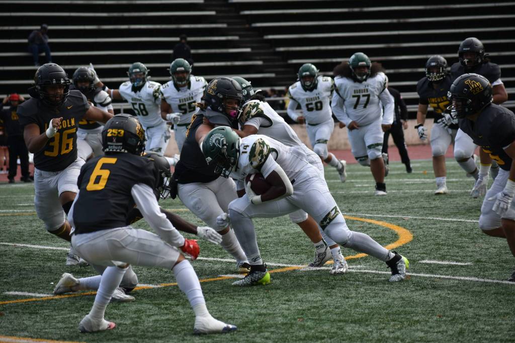 Luvens Valcin absorbs the contact against Lincoln. Ben Ray / The Reporter