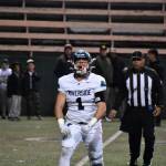 Andrew Shrader celebrates a big sack in the state playoff game against the Fighting Irish. Ben Ray / The Reporter