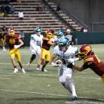 Andrew Shrader attempts to break a tackle against ODea. Ben Ray / The Reporter