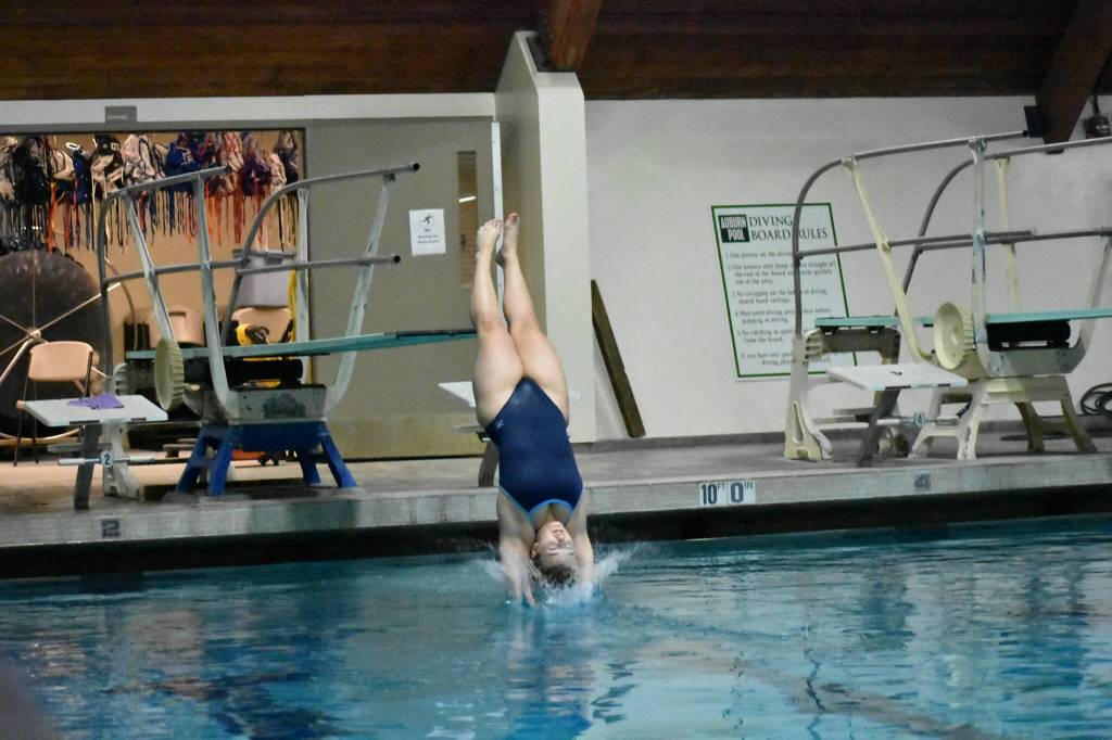 Riverside senior Ava Lear hits the water after winning the state title in 3A Dive. (Ben Ray / The Reporter)