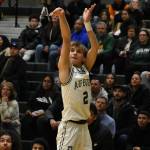Carter Hansen (Jr.) shoots a three in the corner.