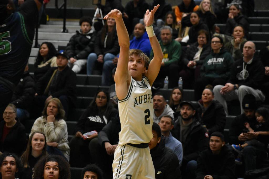 Carter Hansen (Jr.) shoots a three in the corner.