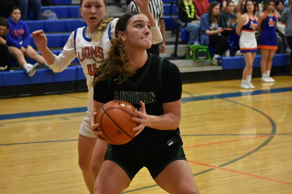 Senior Emmalee Secrest fights for positioning under the basket. Ben Ray / The Reporter