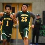 Auburn players Micah Diaz (1) Marvin Abenojar (25) warming up pre-game. Ben Ray / The Reporter