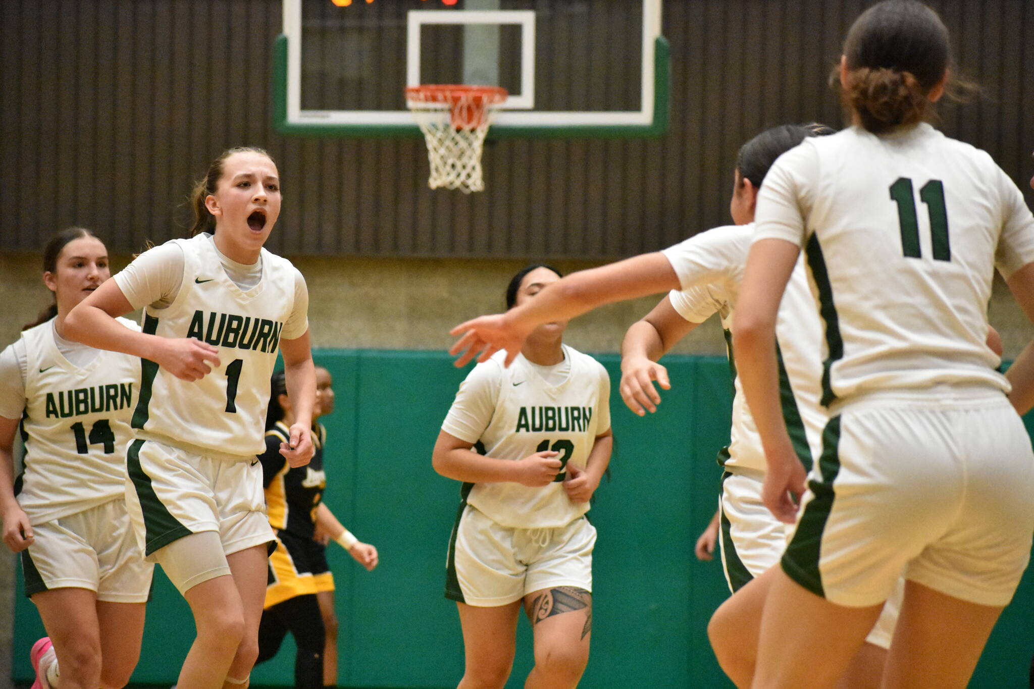 Avery Hansen leads the charge after a time out from Lincoln in the second half. Ben Ray / The Reporter