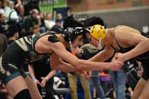 Auburn wrestler is tied up with another wrestler at Todd Beamer. Ben Ray / The Reporter