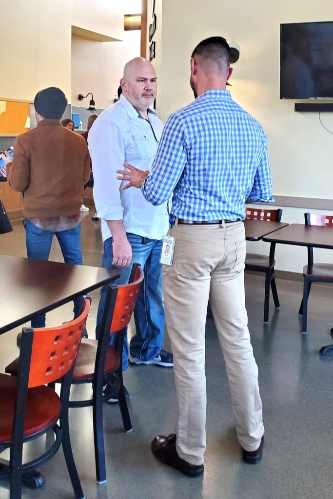 Matt Breeze is an Auburn resident and community member who has frequent experiences with the impact of people dealing with substance use disorder. Here he talks with Scott Stewart, program manager at Recovery Place Seattle for Valley Cities. Photo by Keelin Everly-Lang / The Mirror.