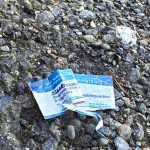 Outside the roundtable, a medication wrapper is in the parking lot of the recovery housing that is also on the property. Suboxone is medication that uses the same chemical compound as lifesaving Narcan to help those dealing with addiction to fentanyl in their recovery. Suboxone and Vivitrol were both discussed several times during the round table. Photo by Keelin Everly-Lang / The Mirror.