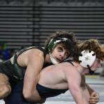 Jace Longmire wrestling his semi-final match with an intense black eye. Ben Ray / The Reporter