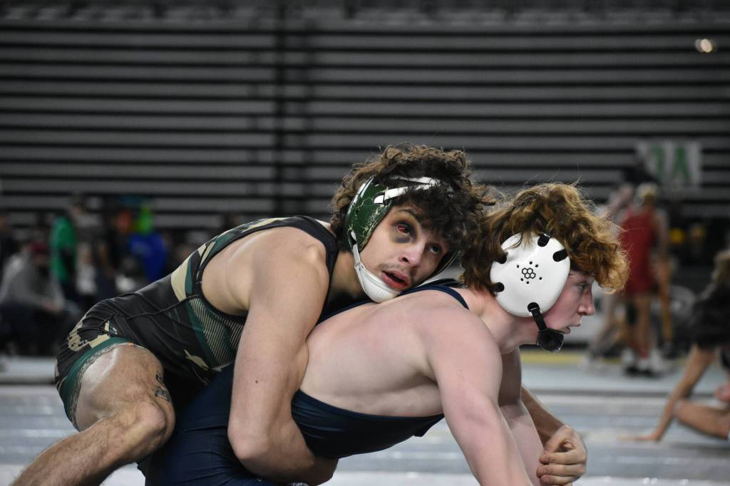 Jace Longmire wrestling his semi-final match with an intense black eye. Ben Ray / The Reporter