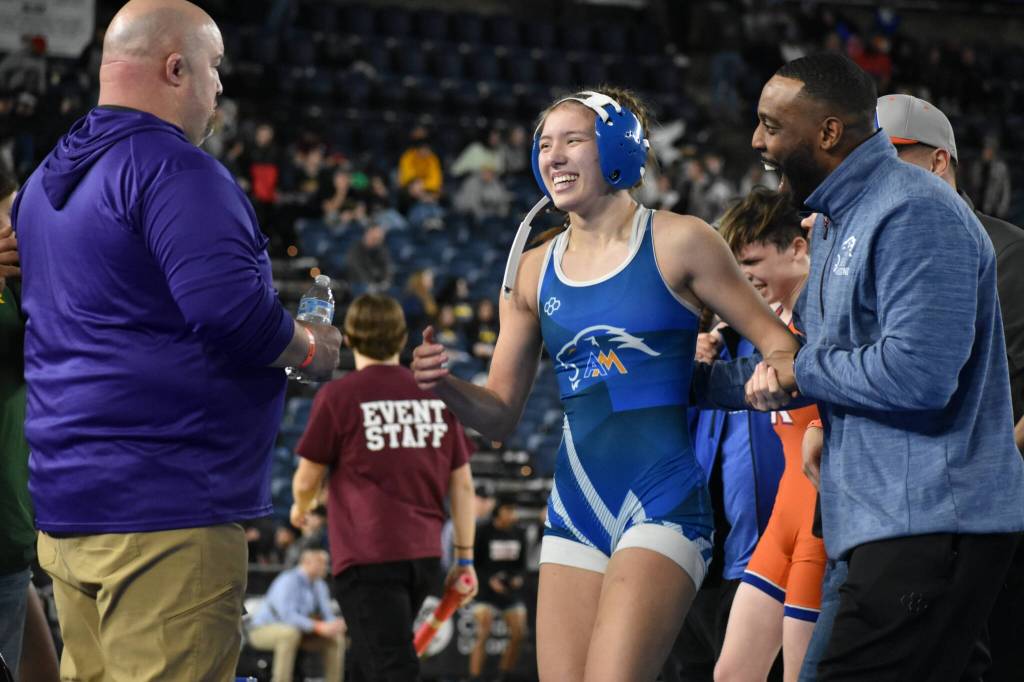 Natalie Marceyes-Weeks wins a big match on day one of the mat classic. Ben Ray / The Reporter