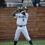 Alec Smetheram rears to go in the batters box in the Trojans first game against Enumclaw. Ben Ray / The Reporter