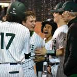 Jaxen Mentink celebrates his homerun with teammates. Ben Ray / The Reporter