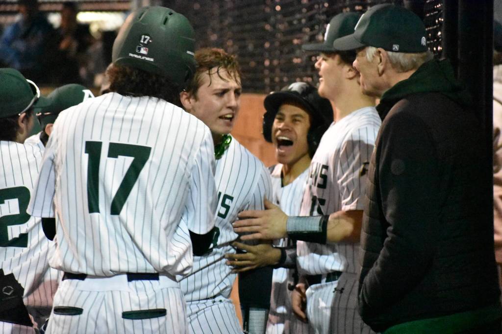 Jaxen Mentink celebrates his homerun with teammates. Ben Ray / The Reporter