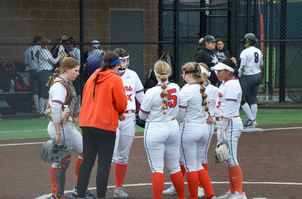 Auburn Mountainview fastpitch fell to Lake Stevens 10-0 at Auburn Riverside on March 22. Pictured: Auburn Mountainview infield and Head Coach Kristin Herren discuss how to handle the Lake Stevens attack. Photos Provided by Baylen Erdmann