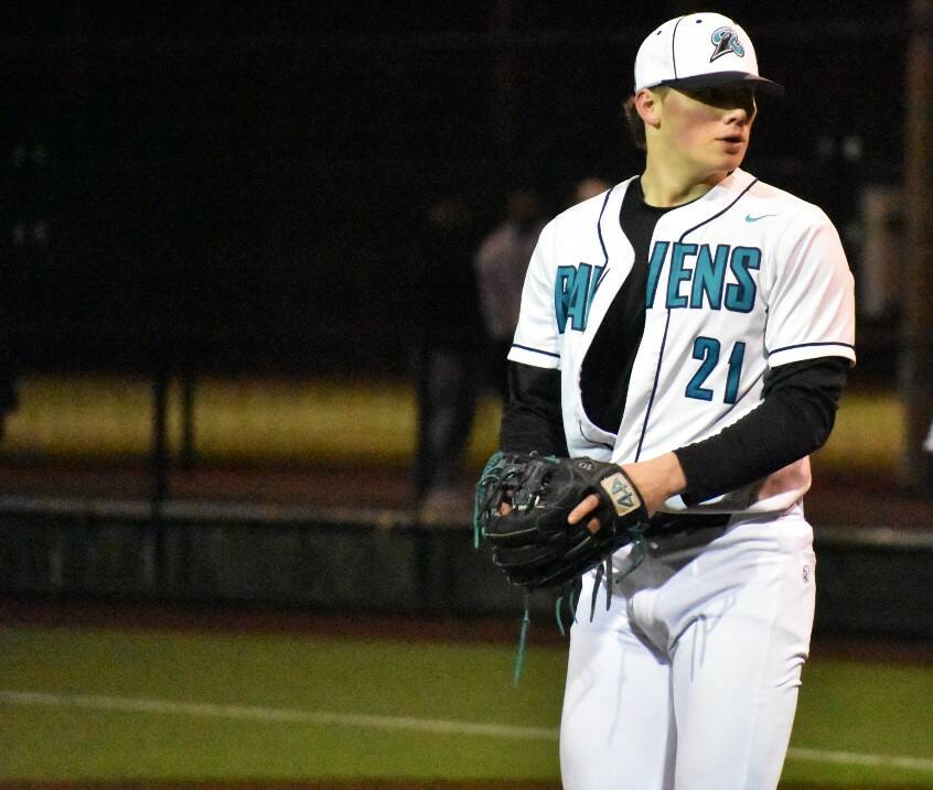 Jackson Padur of Auburn Riverside eyes down the Eagle batters coming out of the bullpen. Photo by Ben Ray / Sound Publishing