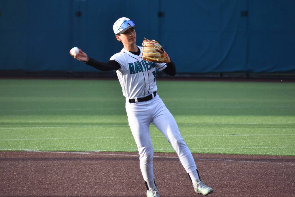 Andre Muneton makes a throw to first base. Ben Ray / The Reporter